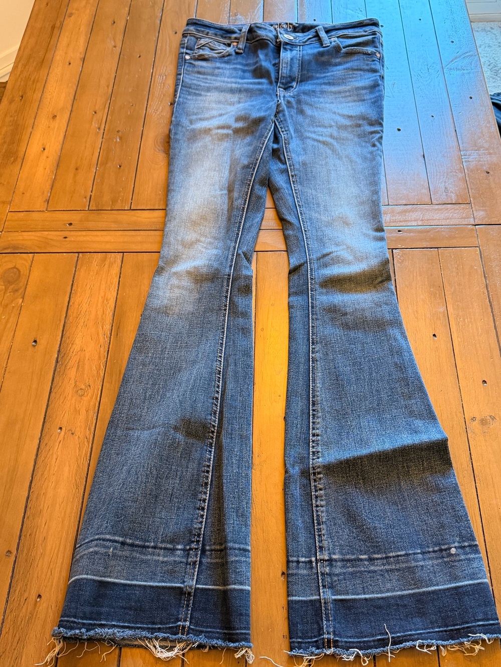 edgely by Maurice’s mid-fit Dark Indigo Flared Jeans with Raw Hem - 0 Long